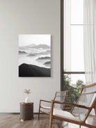 Tranquil Peaks black and white landscape print featuring mist-covered mountains and serene waters, available as a canvas or fine art paper print.